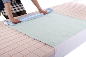 Absorbent base sheet with drawstrings